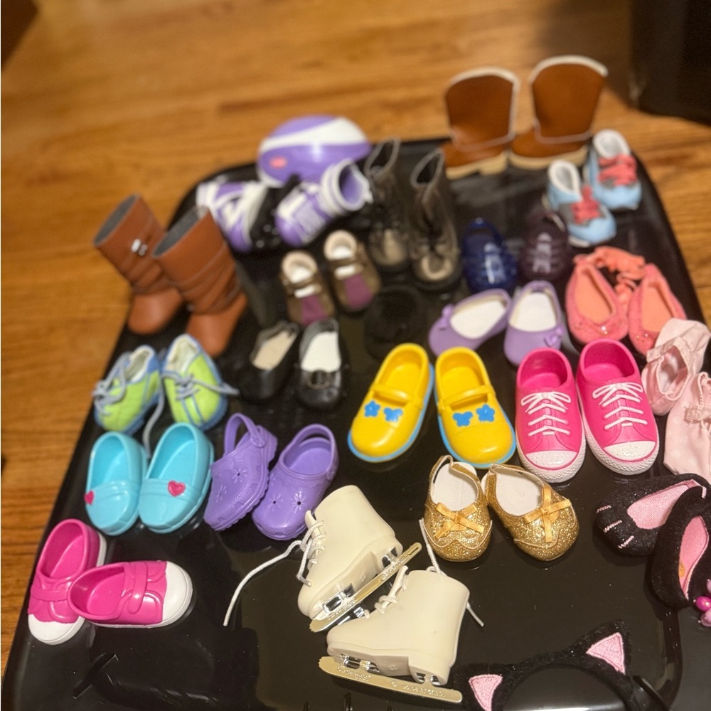 Assorted Doll shoes and doll outfits for 18 inch dolls.
